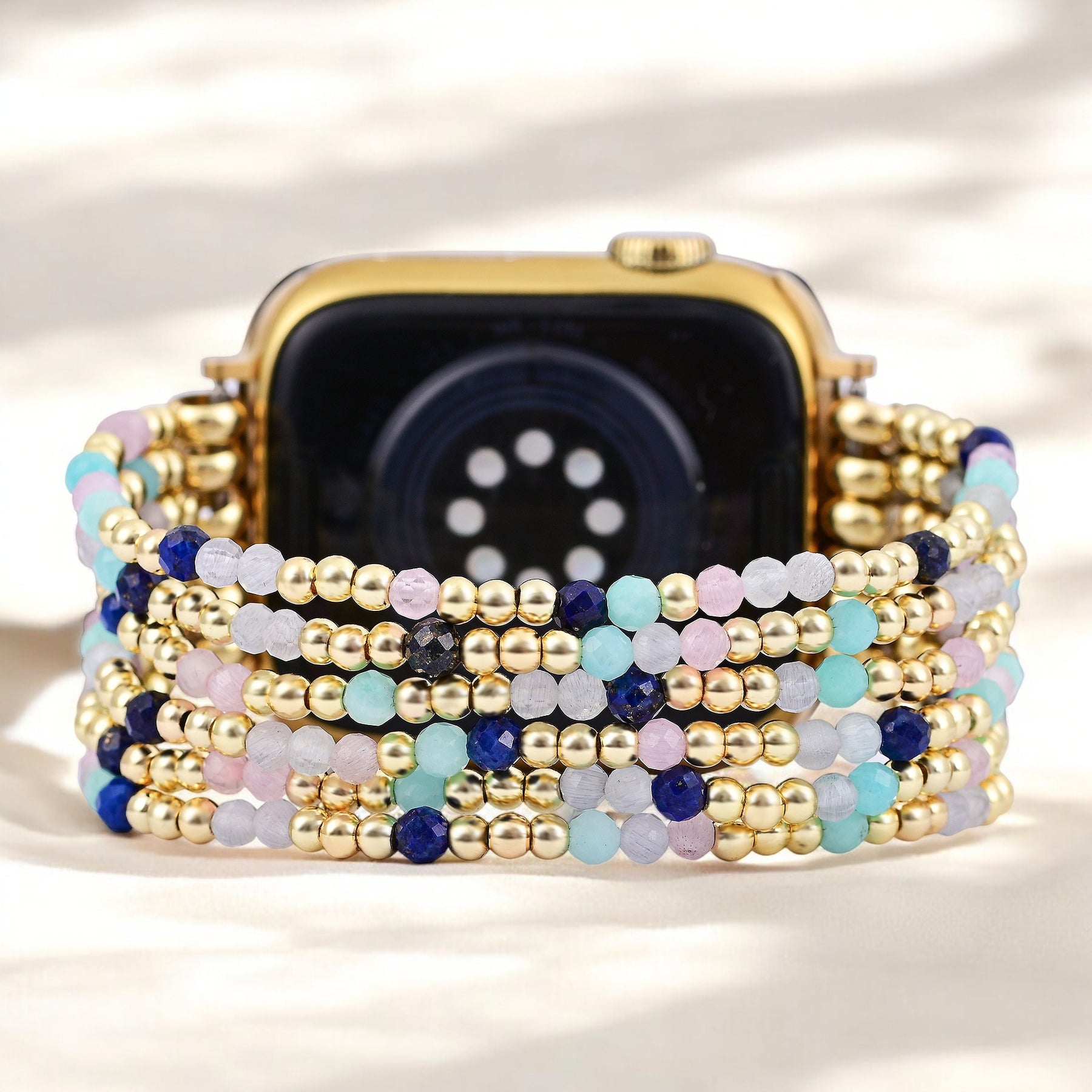골드 및 펄 스트레치 Apple Watch 스트랩
