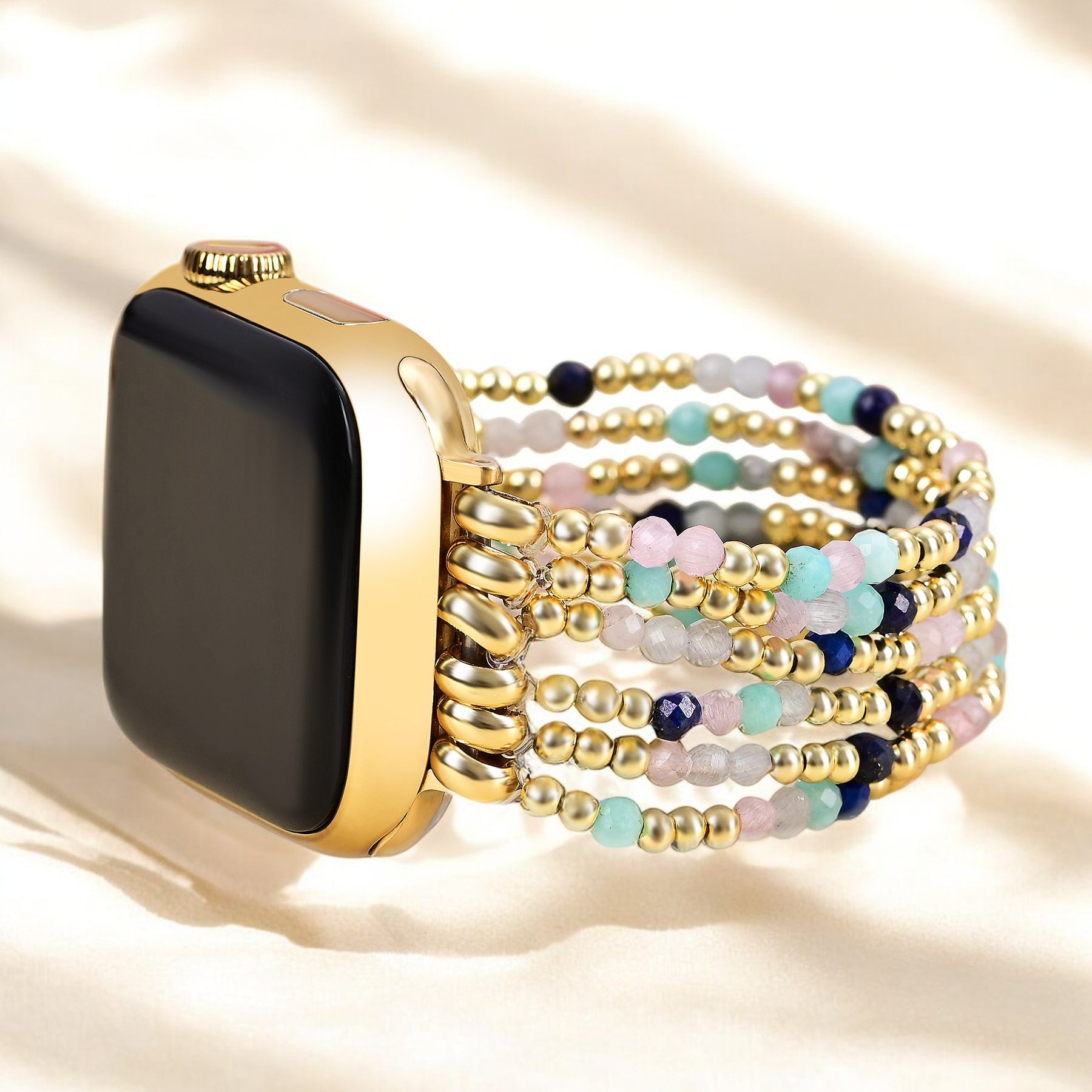 골드 및 펄 스트레치 Apple Watch 스트랩